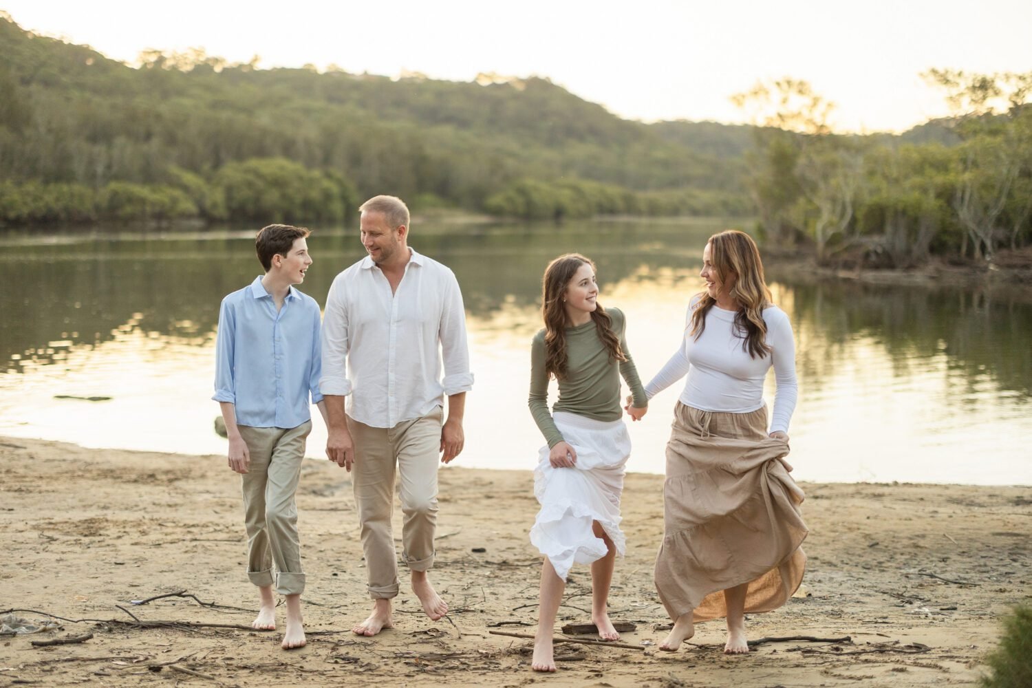 Family photoshoot pose on beach with boy and girl