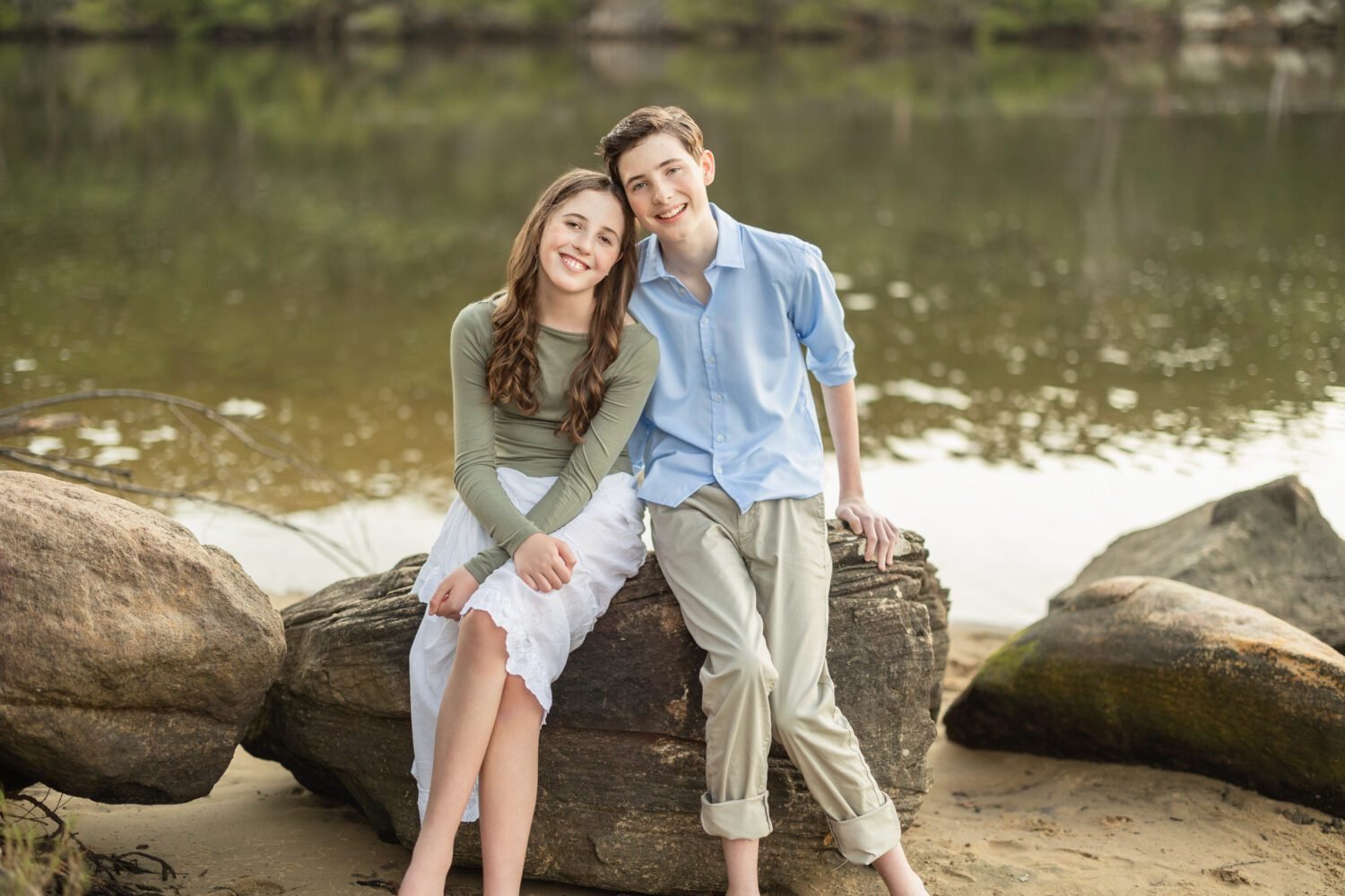 Family photoshoot pose of brother and sister 