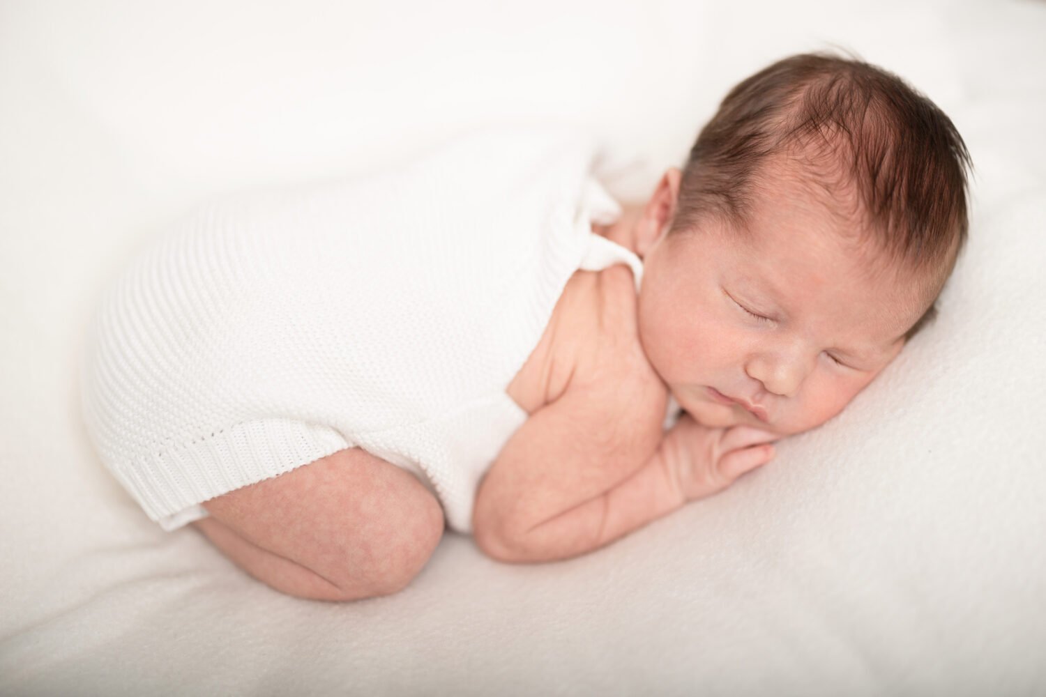 Newborn baby boy asleep