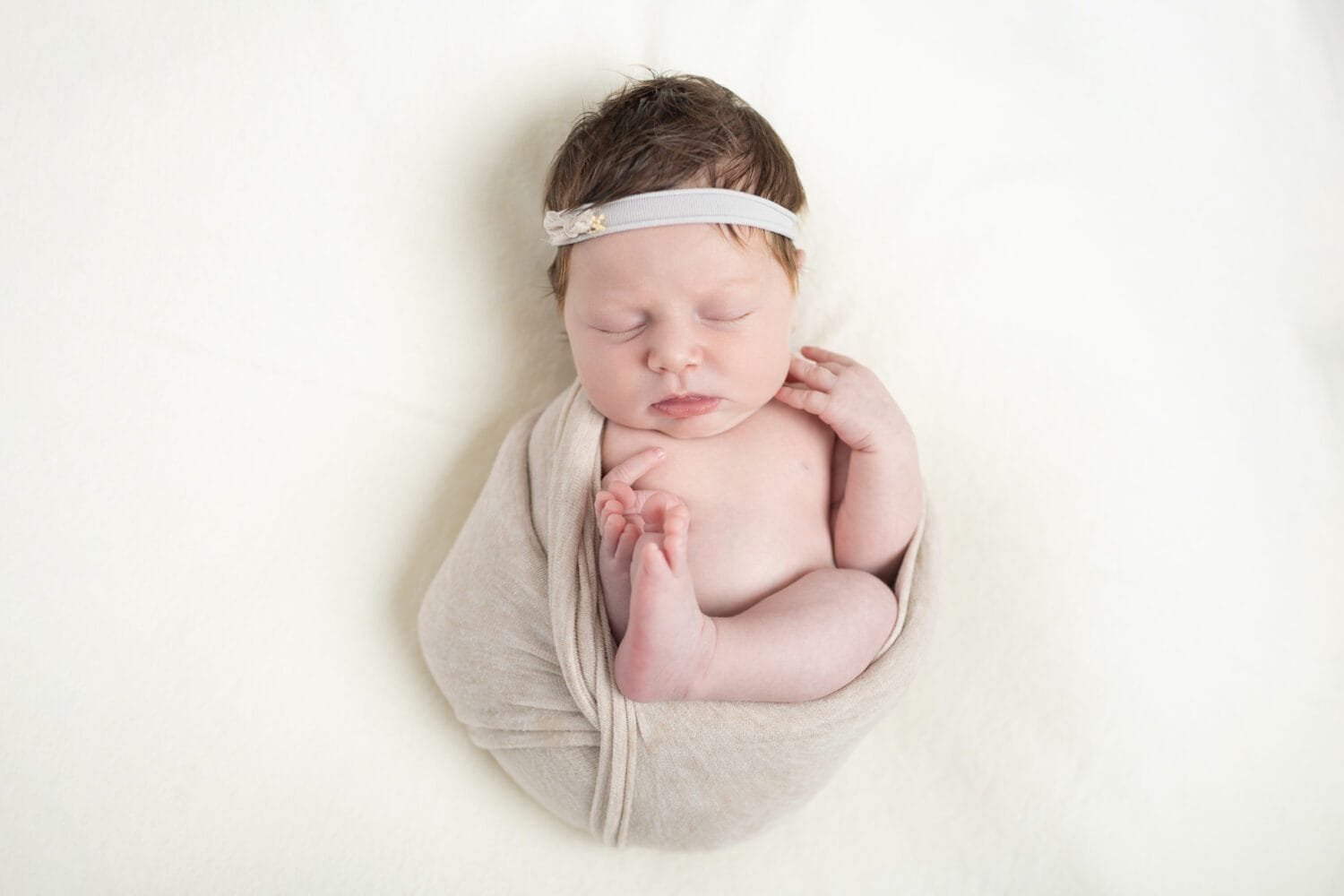 Photo of newborn baby girl sleeping